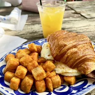 Croissamich (sans ham) with crispy potatoes &amp;OJ