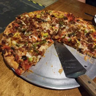 "The Works" pizza. Everything imaginable on thin crispy crust. These folks do it right.