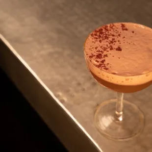 a chocolate drink in a coupe glass