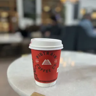 a cup of coffee on a table