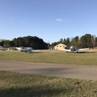 a small plane parked in a field