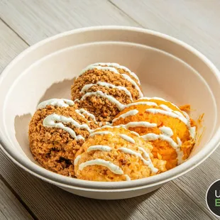 a bowl of food on a wooden table