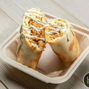 two burritos in a styrofoam container