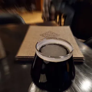 a glass of beer on a table
