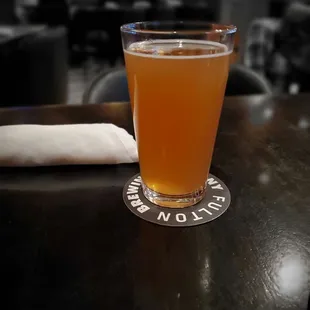 a glass of beer on a table