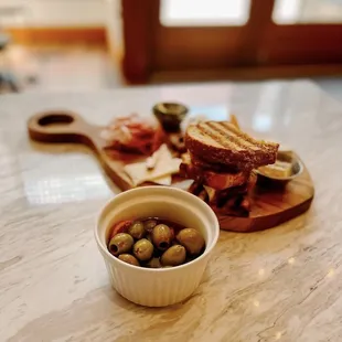 a sandwich and olives