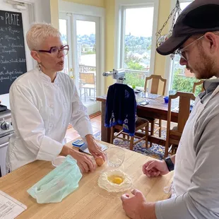 Jennifer explains the science of cooking and history of the dishes all while having you totally drive the hands on cooking experience.