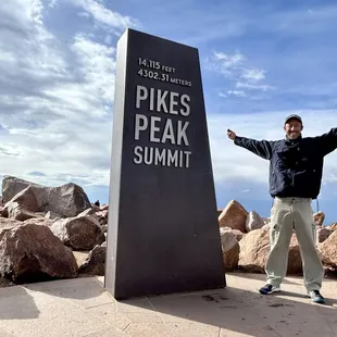 The summit statue standing at 14,115 feet.
