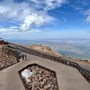 Views standing next to the Summit Visitor Center with the cog railway parked at the station.