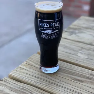 a pint of beer on a table