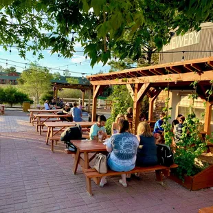 people sitting at picnic tables