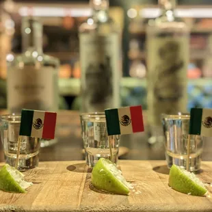 shot glasses of tequila and lime