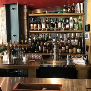 a bar filled with bottles of alcohol