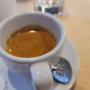 Perfect espresso pull also served with filtered water.  Excellent new local coffee shop that actually took Starbucks place!