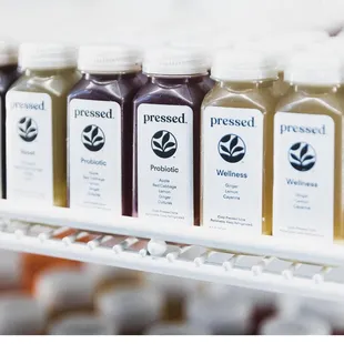 This location is a Pressed™ Post Hub, selling cold-pressed juices, wellness shots, and smoothies