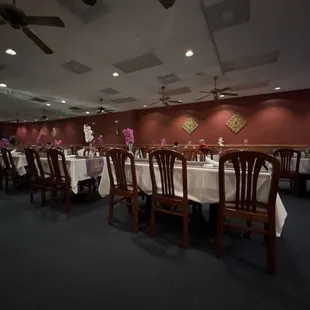 a dining room with tables and chairs
