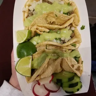 3 carne asada tacos with the guacamole sauce
