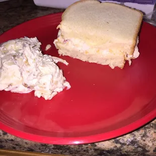 1/2 of my pimento cheese sandwich &amp; potato salad.