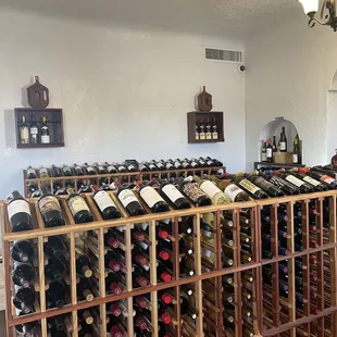 rows of wine bottles in a wine cellar