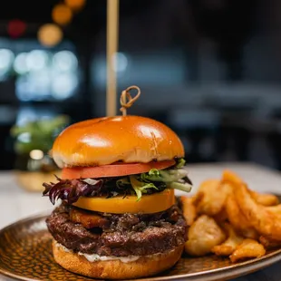 a burger and fries on a plate