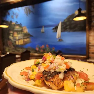 a hand holding a plate of food