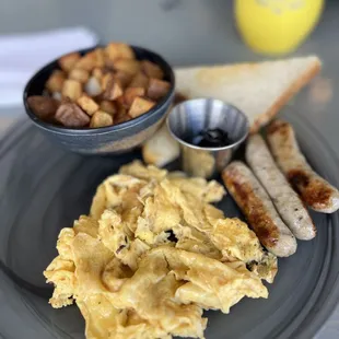 Classic combo: 2 eggs to order, sausage (choice of bacon or ham available), potato hash, buttered sourdough