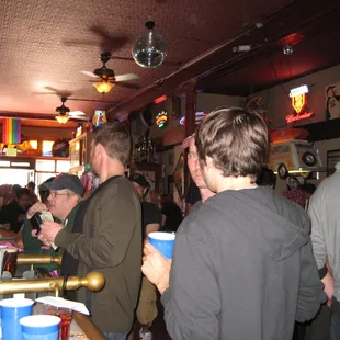 a crowd of people at a bar