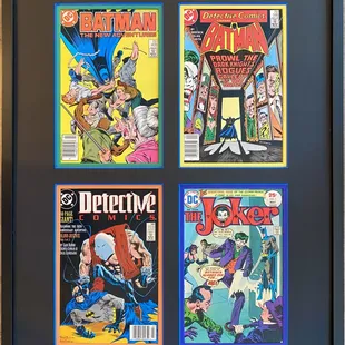 Batman comic collection with multi-colored inner mats