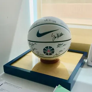 Custom basketball stand made of wood from the old McKale court.