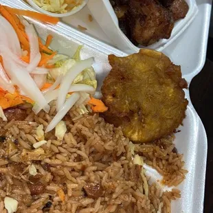 Griot (fried pork) dinner, rice and beans, pikliz, salad, tostones