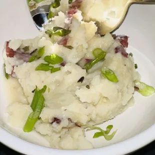 a plate of mashed potatoes and asparagus