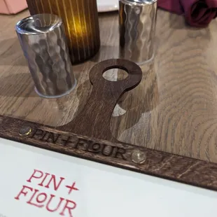 a wooden cutting board on a table
