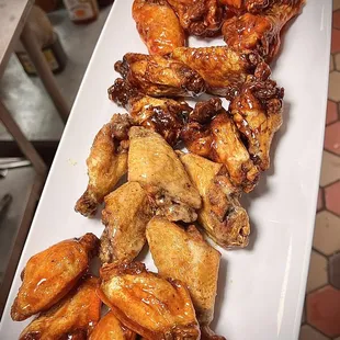a platter of chicken wings