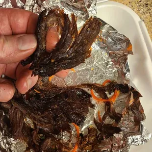 a person holding a piece of food