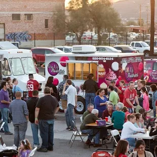 a large group of people eating outside