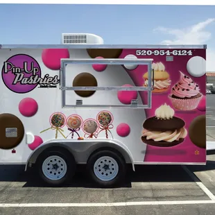 an ice cream truck in a parking lot