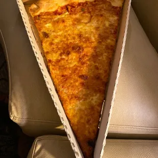 a slice of pizza in a box