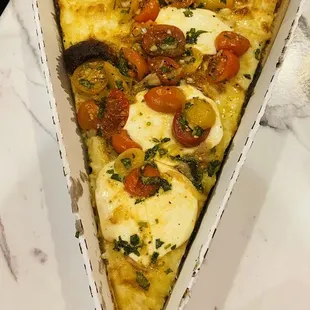 a slice of pizza in a box