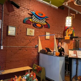 a woman behind a counter