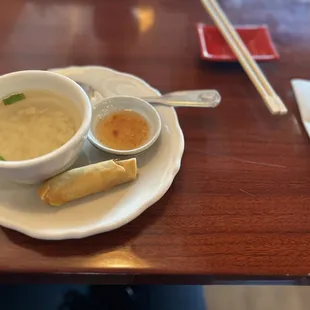 Chicken and rice soup with a vegetable spring roll.