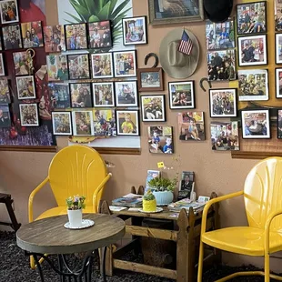 two yellow chairs and a table