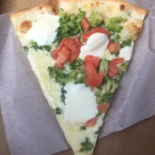 Fresh mozzarella broccoli tomato pizza slice