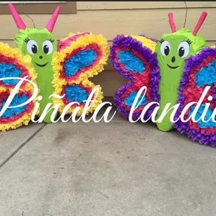 two butterfly pinatas