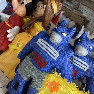 Mickey, Belle, and Transformer Piñatas