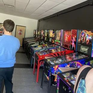 a row of pinball machines