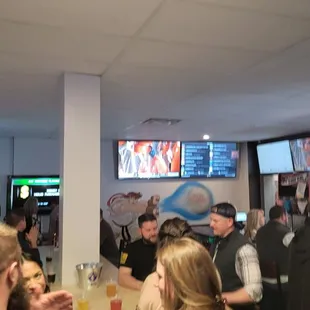 a large group of people sitting at a table