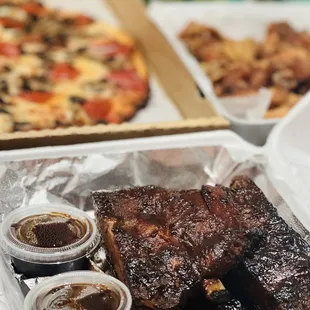 Pork Ribs a la Carte; and Family Special Deal: LRG Pizza, Jumbo Wings, 4 cans soda included.