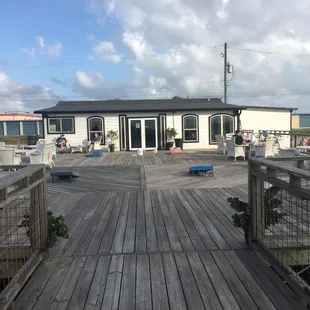 Outdoor deck with plentiful seating.