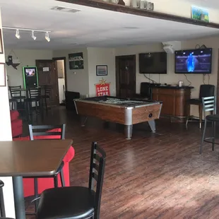 Inside bar with seating, men&apos;s and women&apos;s restrooms, pool table and shuffleboard table. Kid friendly with golden tee and jukebox.