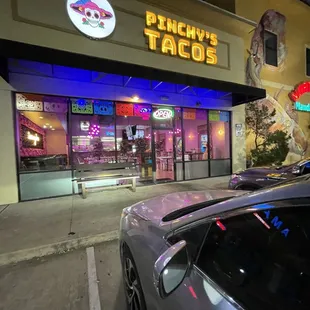 a car parked in front of a restaurant